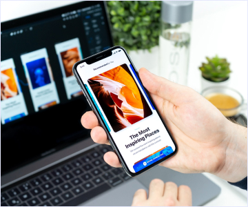 Hand holding a phone with some picture on it